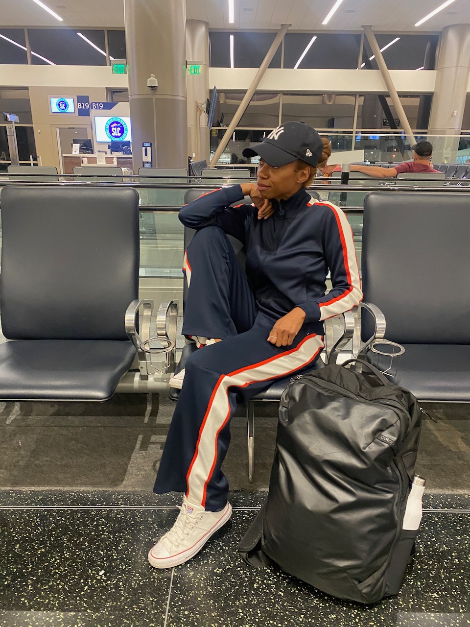 allpa bag black at airport packing list for summer trip