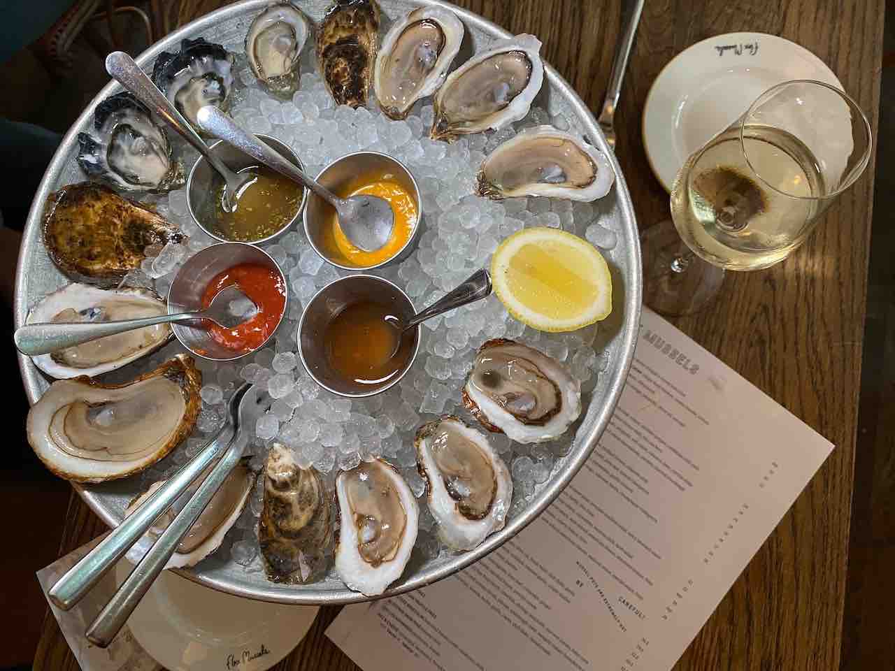 oyster flatlay Taste your way through the best oyster bars in NYC at Flex Mussels. From rooftop lounges to candlelit gems, find your perfect shuck-worthy spot.
