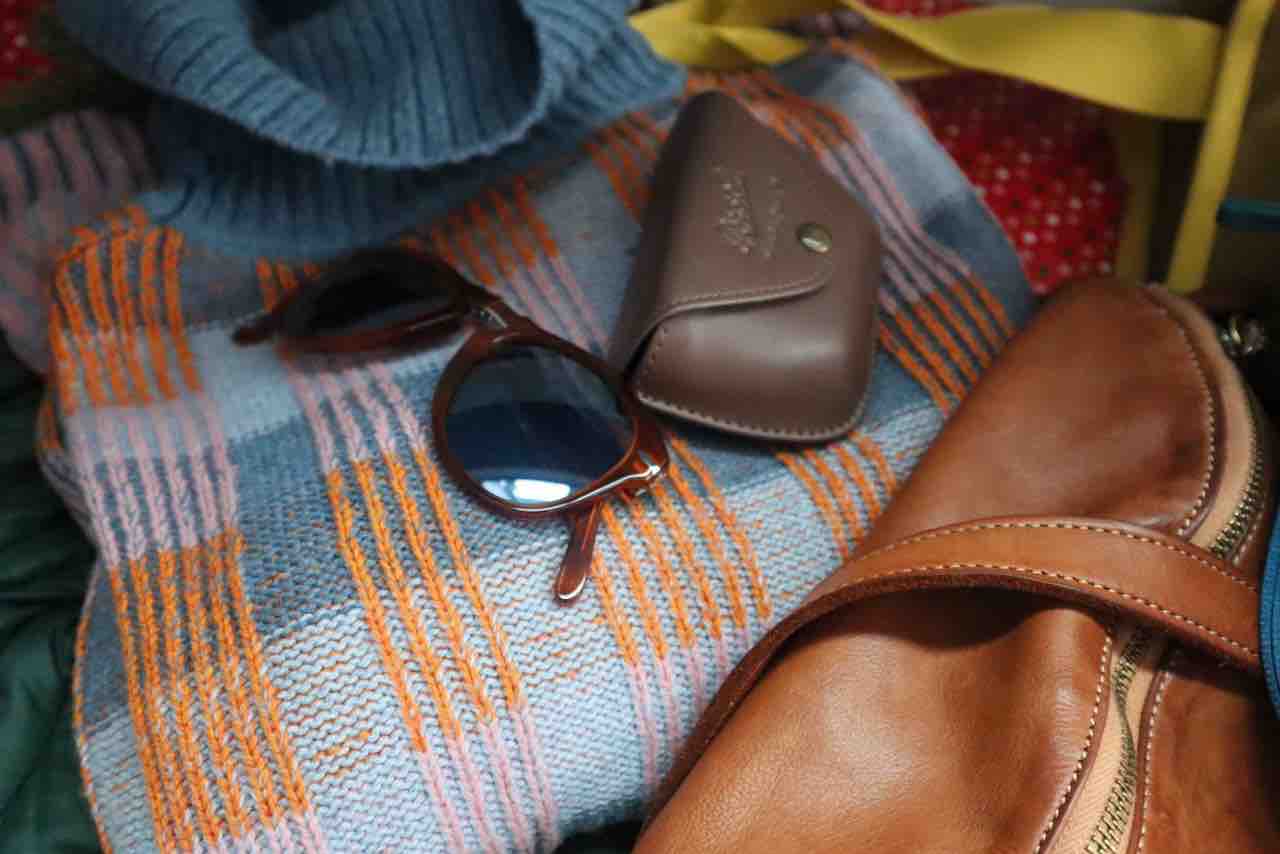 cotopaxi turtle neck, sunglasses, bolsa nova bag Discover Our Holiday Gift Guide Packed With Inspired Gift Ideas For Everyone On Your List, All In One Place Like Cotopaxi Libre Boxy Sweater